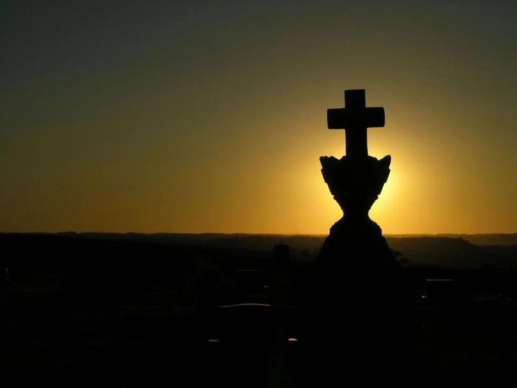 Christian Cross icon and the sunset