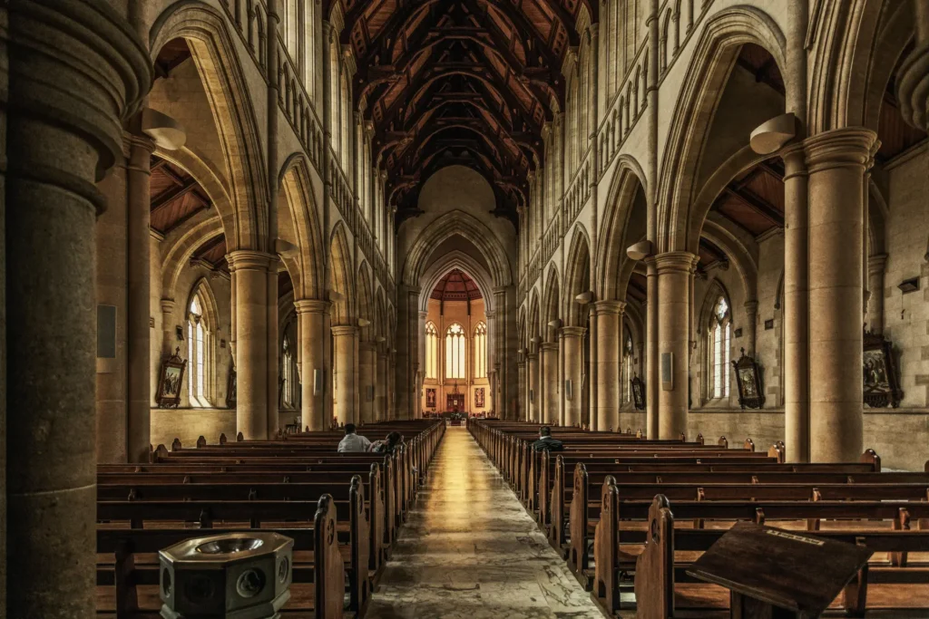 Interior of a grand, historic church aisle.