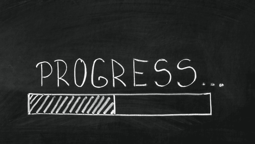 Progress bar on chalkboard background.