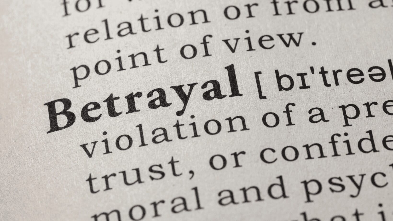 The word Betrayal focused on a page