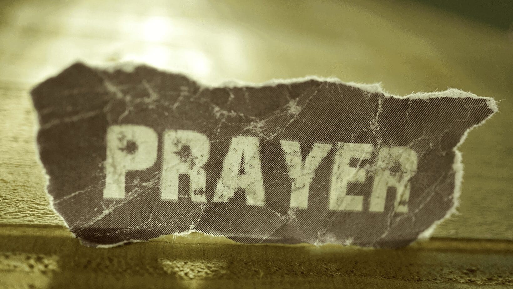 A torn piece of paper that says Prayer