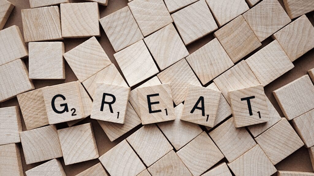 Scrabble tiles spelling the word "great".
