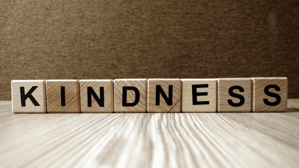 Wooden blocks spelling the word "Kindness".