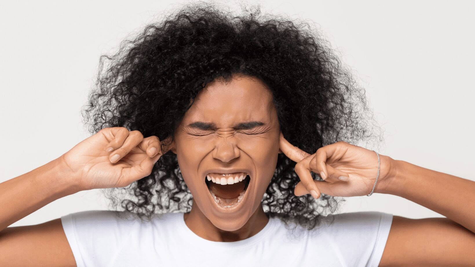 A Girl Shouting With Fingers In Hand