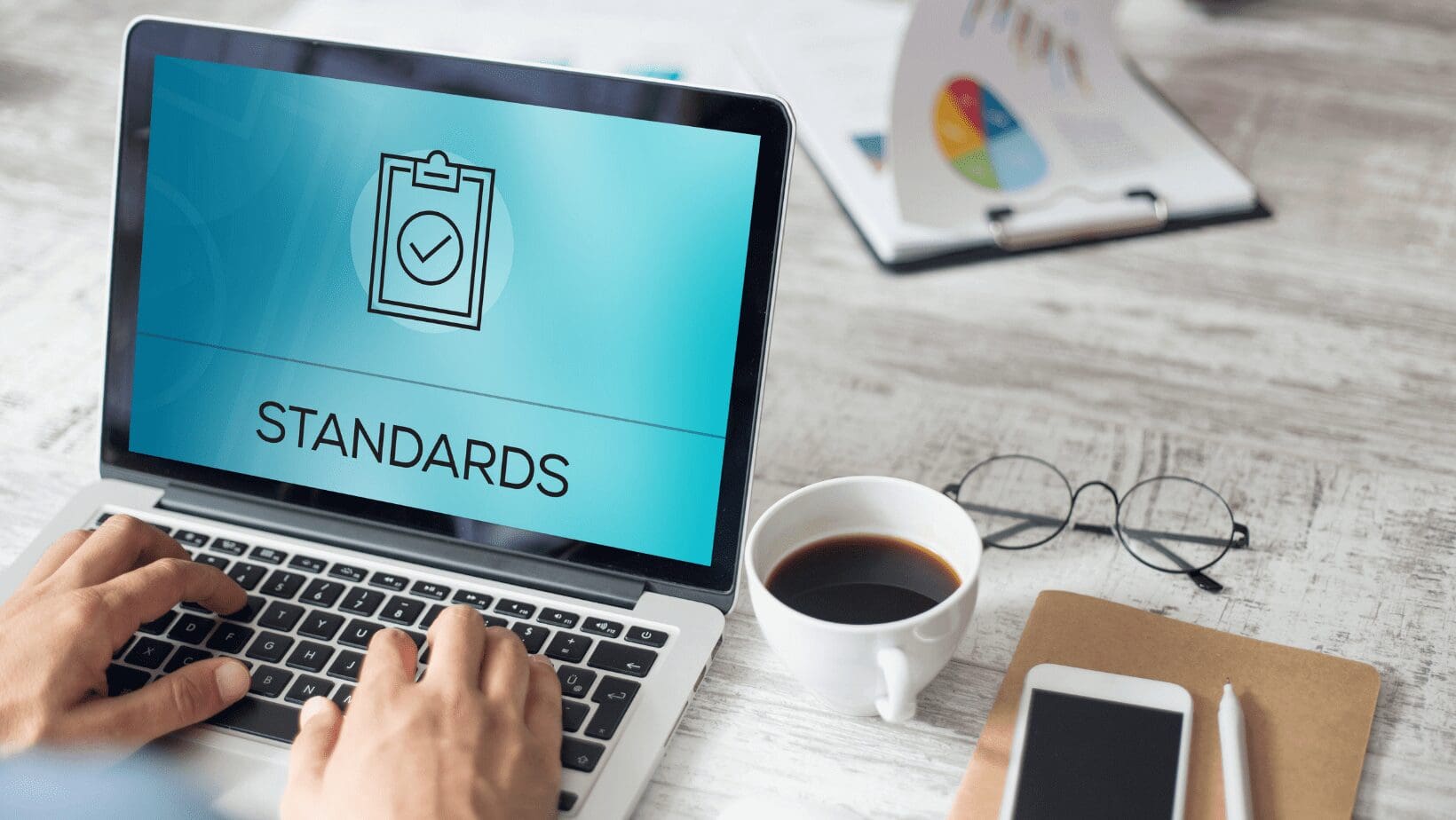 Laptop screen showing standards checklist icon.
