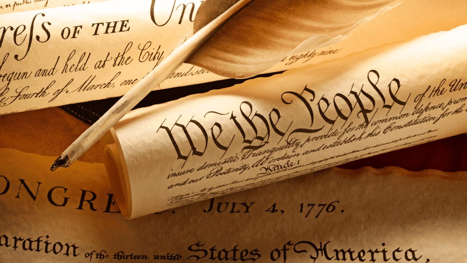 U.S. Constitution with quill pen and parchment.