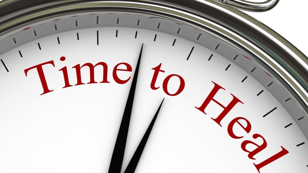 Clock hands pointing to the words Time to Heal