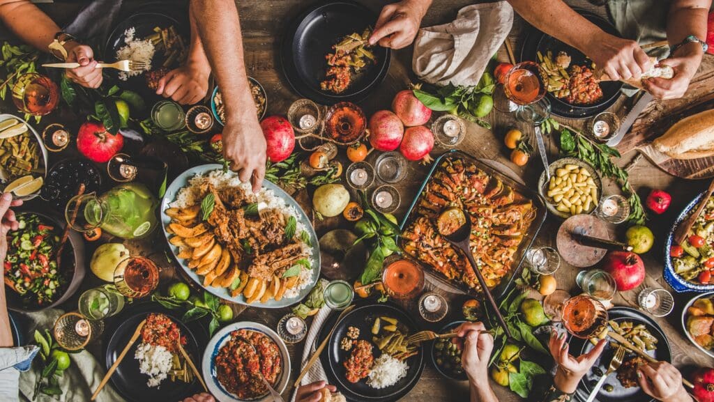 People enjoying a diverse feast together.