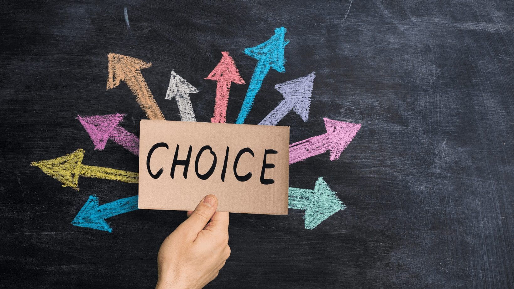 Hand holding "Choice" sign with colorful arrows.