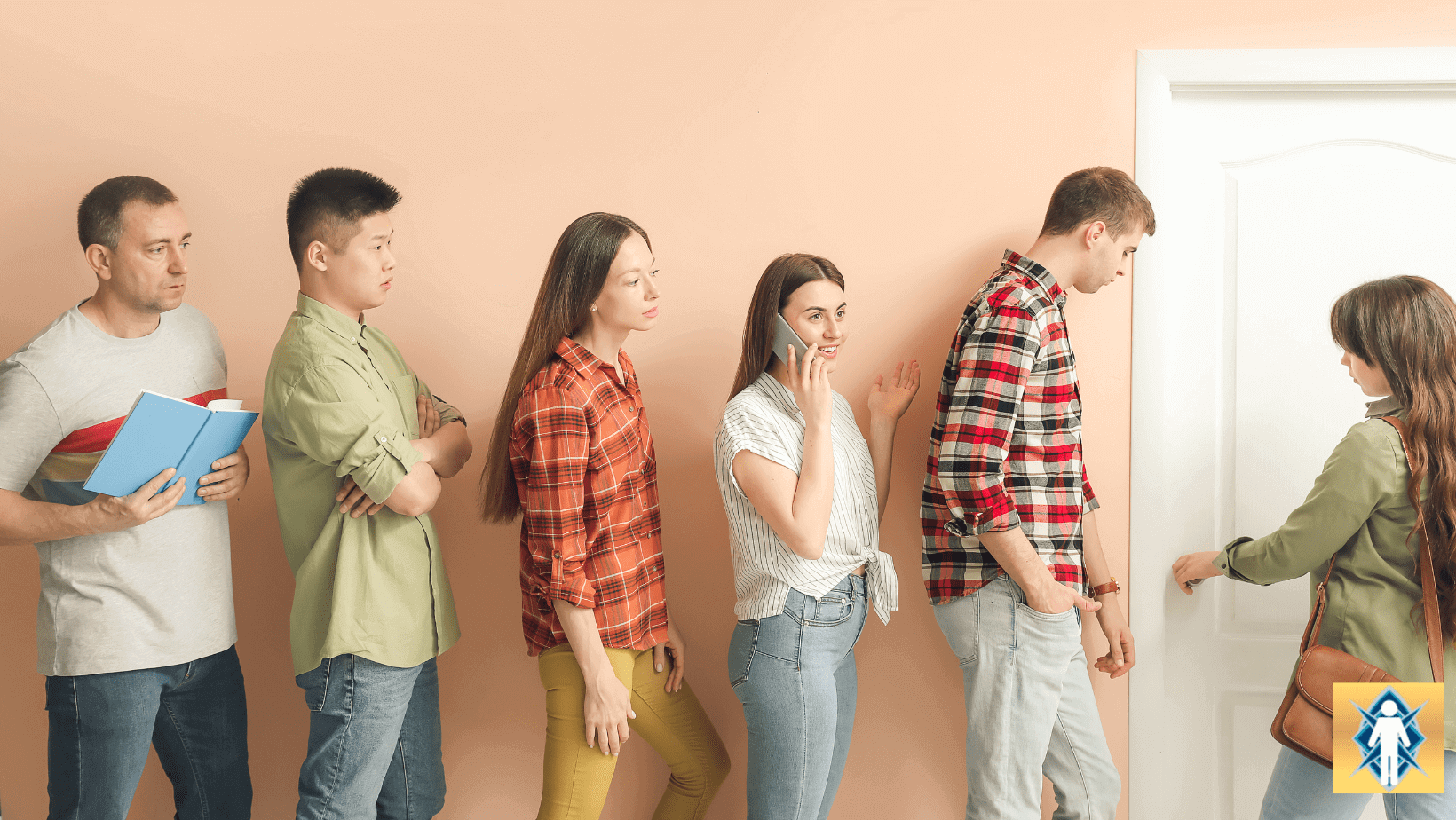 People standing in line at a door.