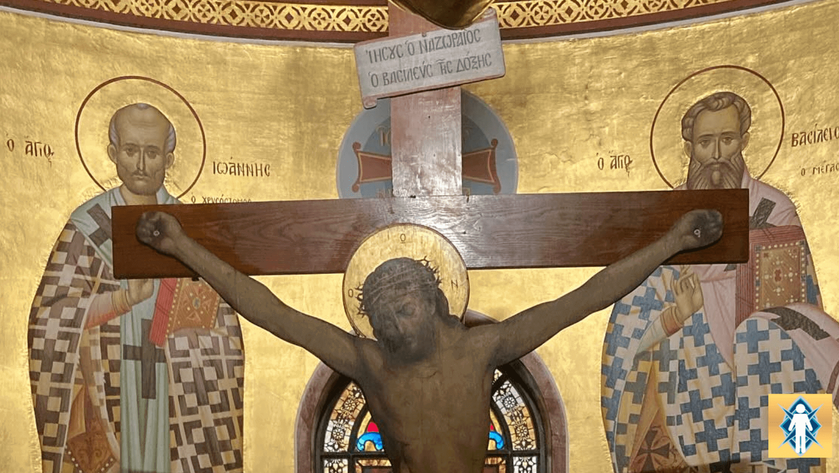 Crucifixion scene with religious figures background.