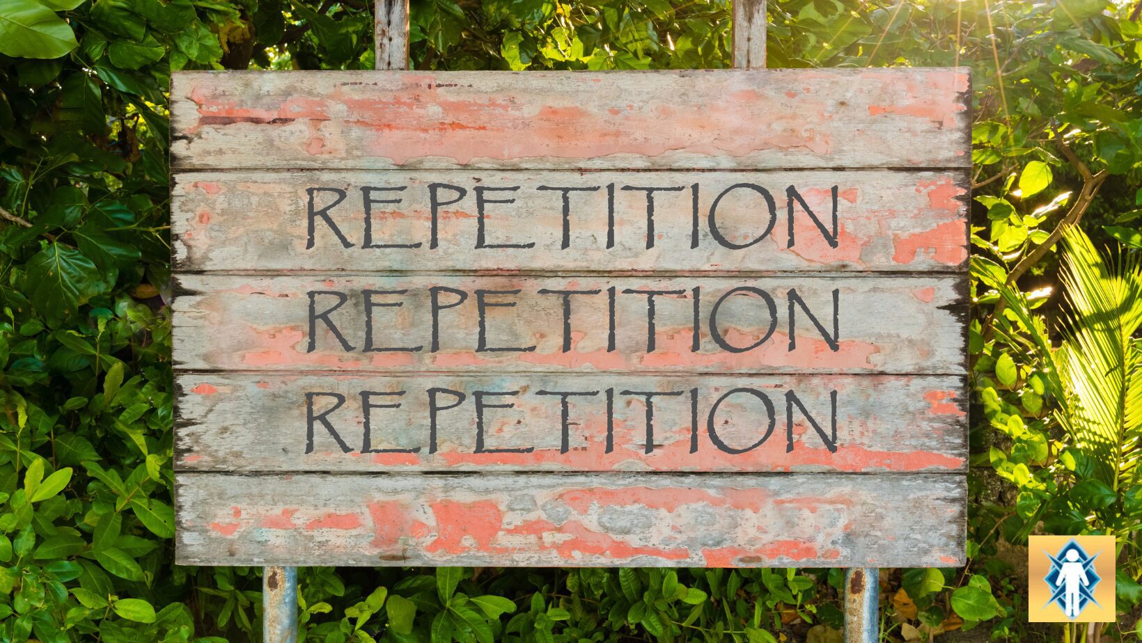 Wooden board with the word 'REPETITION' written multiple times.