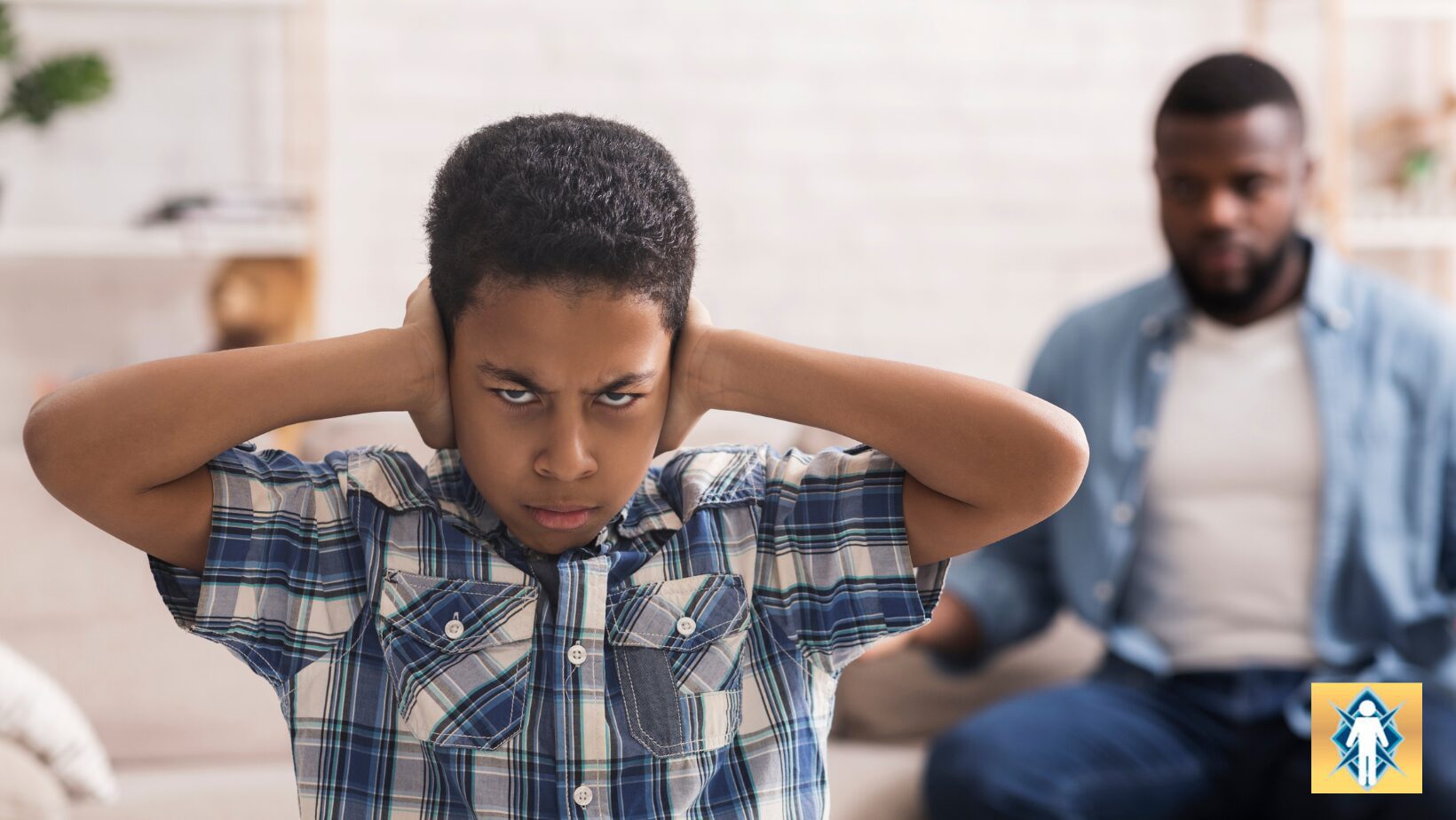 Man looking frustrated and holding his head with hands behind.