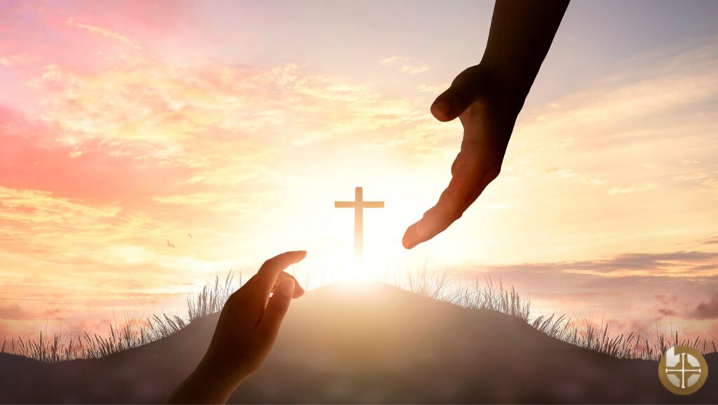 Hands reaching towards a glowing cross.