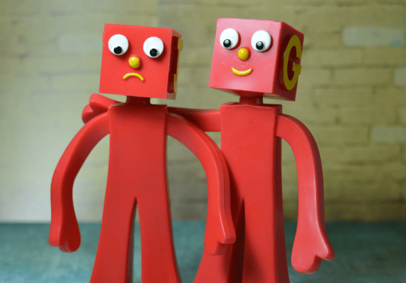 Artwork of two red toy figures