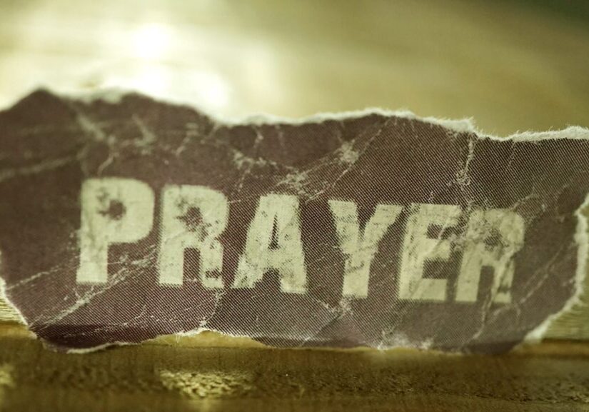 Prayer written on a paper kept on the ground